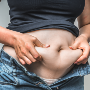 Woman holding their stomach