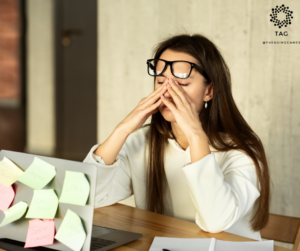 Woman with strained eyes in front of a laptop